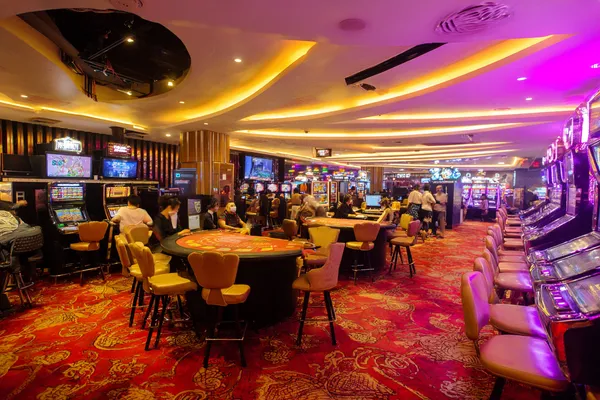 SPINARAA Casino Games — Enjoy nonstop entertainment A close-up shot of golden coins falling around a spinning roulette wheel, representing immersive casino action at SPINARAA.